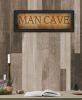 "Man Cave" by Artisan John Jones; Ready to Hang Framed Print; Black Frame